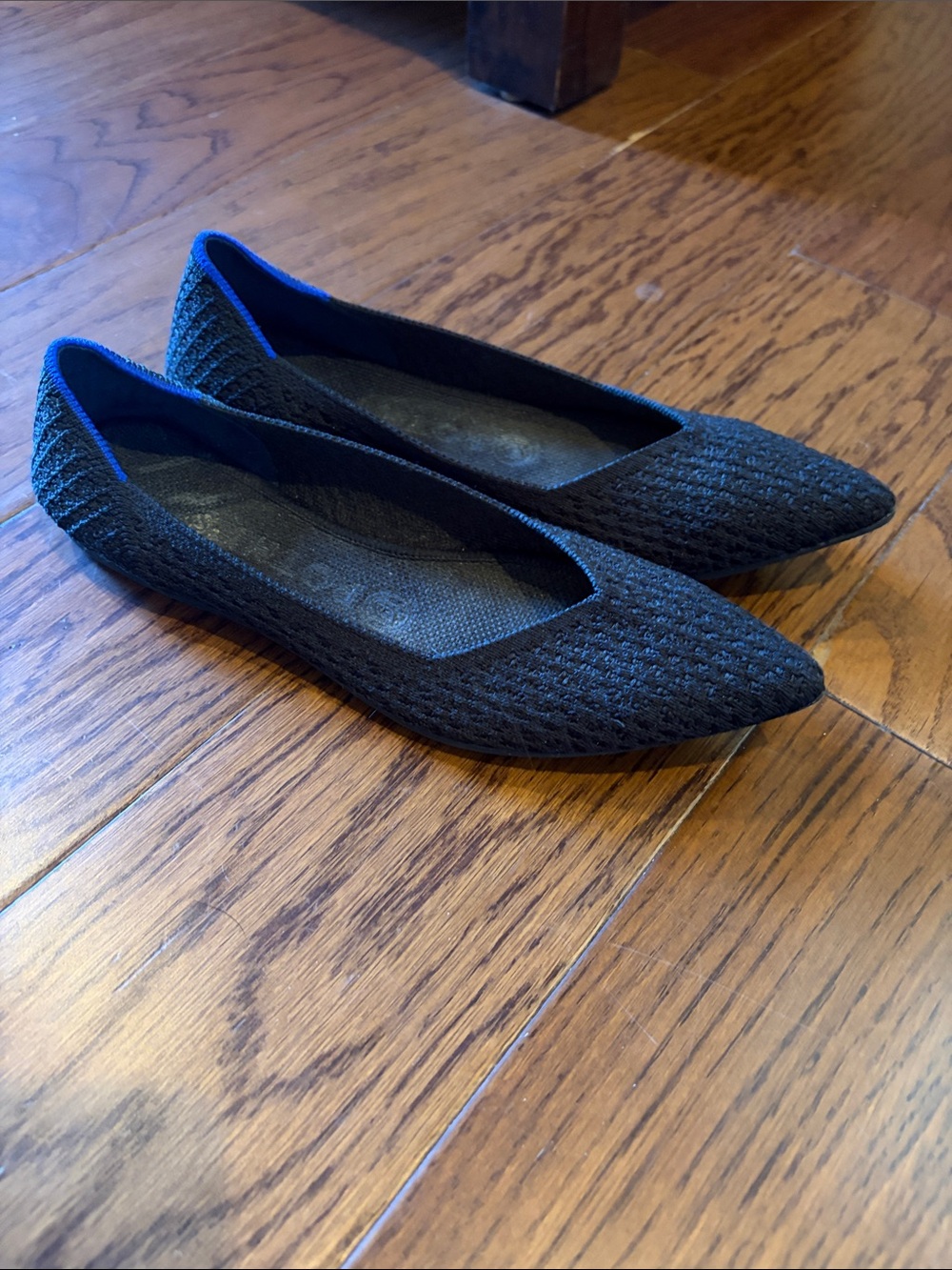 Rothy’s black honeycomb point flats